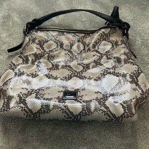 Dooney and bourke snake skin hand bag.